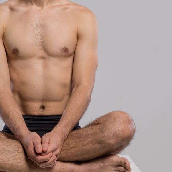 Man sitting in a peaceful posture during morning meditation